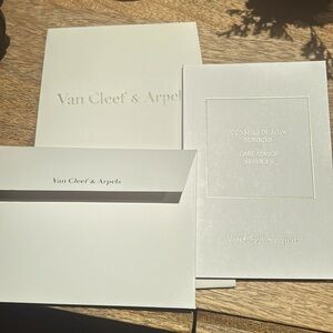 Van Cleef & Arpels bag, card and care advice booklet